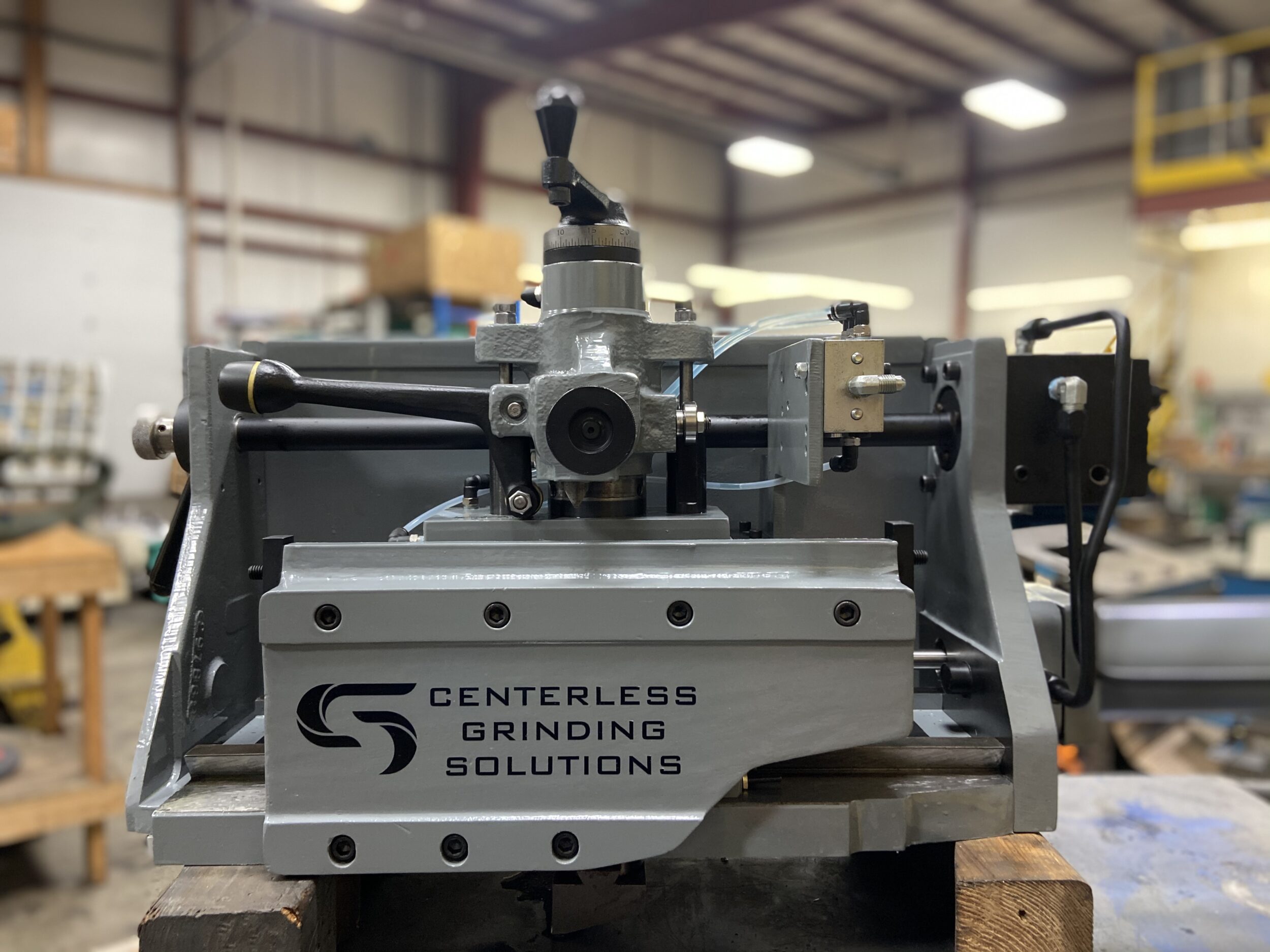 Regulating Wheel Truing Units